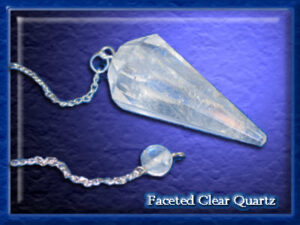 A clear quartz crystal pendulum with chain.