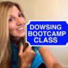 A woman holding up a sign that says " dowsing bootcamp class ".